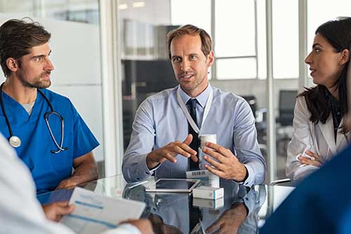 clinical director addressing his staff