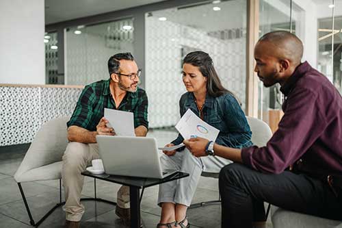 group of three behavioral health executives discussing finance