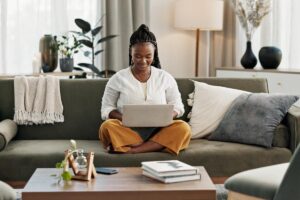 a patient uses a laptop to research how alumni management supports recovery from home