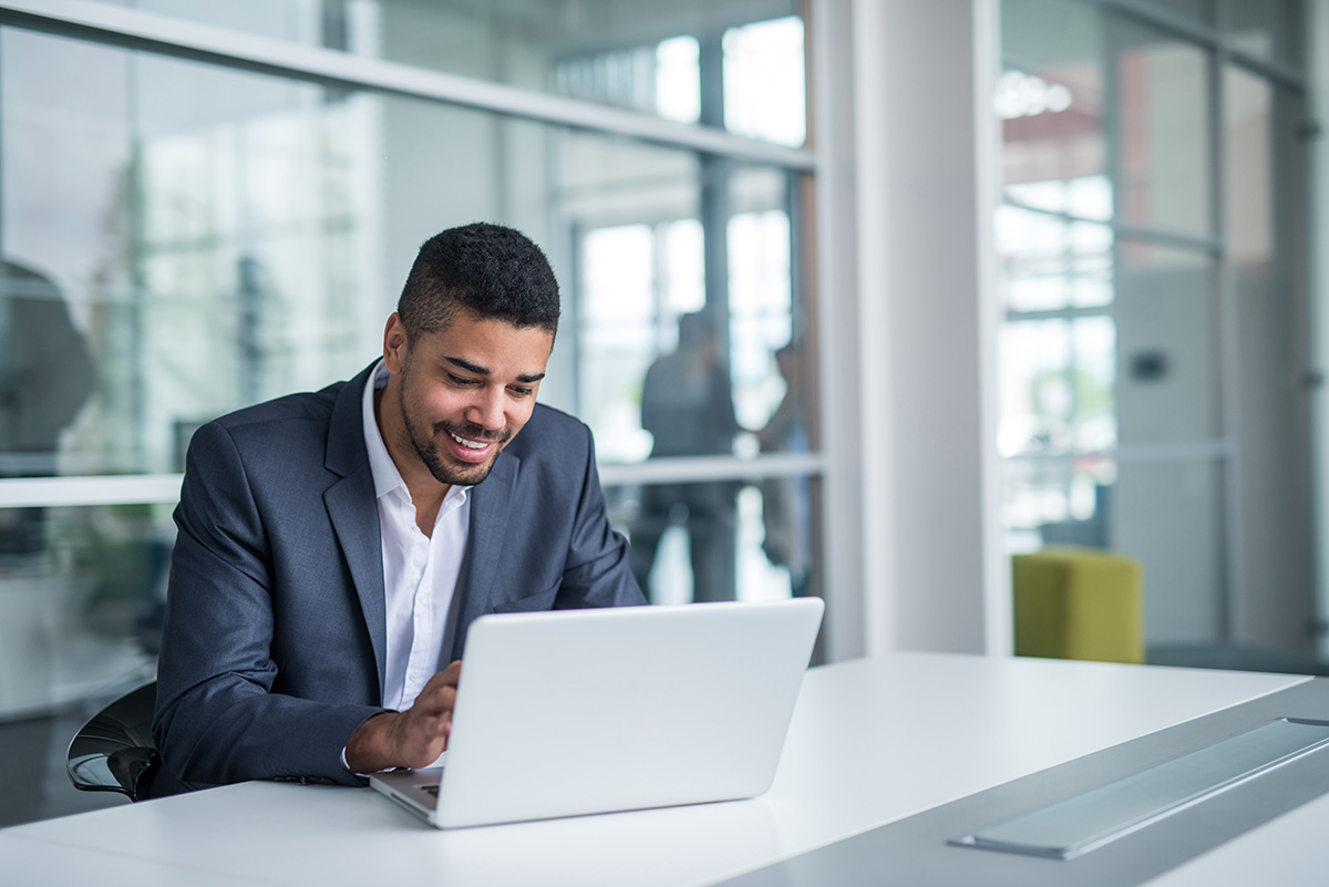 a person uses a laptop to research how alumni management enhances patient follow-up