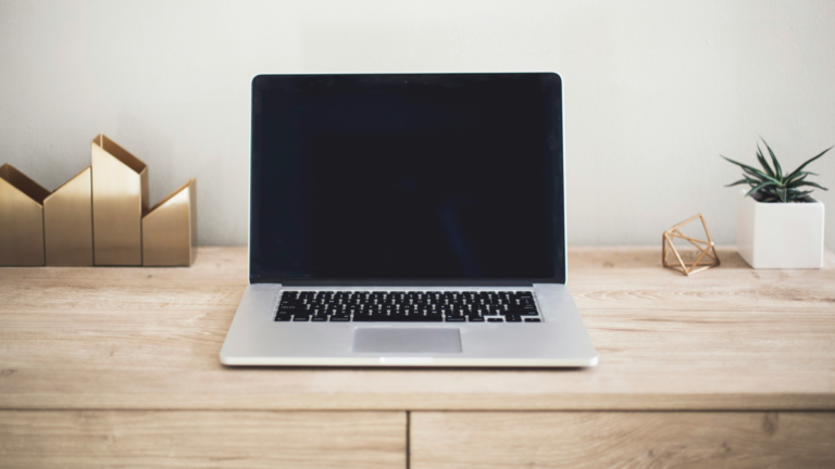 An open laptop on a desk representing behavioral health software and digital workflows.