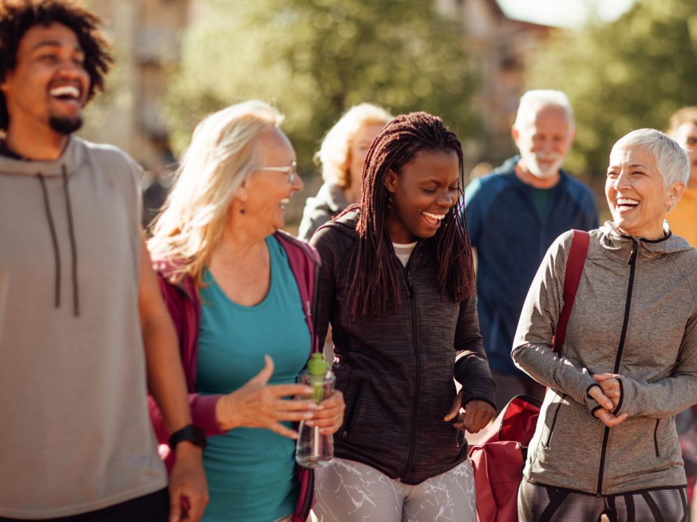 Smiling group of people walking together outdoors